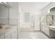 Bright bathroom with double vanity, soaking tub, glass block window and updated fixtures at 1860 Park Forest Blvd, Mount Dora, FL 32757