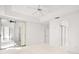 Bedroom with a sliding glass door, ceiling fan, and access to the closet at 1860 Park Forest Blvd, Mount Dora, FL 32757