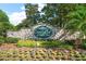 Stone sign for The Country Club of Mount Dora with colorful flowers at 1860 Park Forest Blvd, Mount Dora, FL 32757