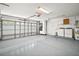 Spacious garage with epoxy flooring, washer, dryer, and plenty of room for storage at 1860 Park Forest Blvd, Mount Dora, FL 32757