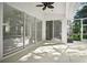 Large sliding glass doors provide access to the screened-in patio and backyard at 1860 Park Forest Blvd, Mount Dora, FL 32757