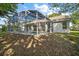 Spacious screened-in pool enclosure offering relaxation and entertainment in a private backyard setting at 1860 Park Forest Blvd, Mount Dora, FL 32757
