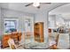 Versatile dining room with wood desk, table set, and ample natural light at 1871 W Schwartz Blvd, Lady Lake, FL 32159