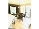 Dining room next to the kitchen features a chandelier and windows with decorative curtains at 1875 Oxford Ln, The Villages, FL 32162