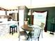 Dining room with views to the kitchen and backyard at 1875 Oxford Ln, The Villages, FL 32162