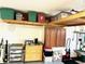 The garage is equipped with storage cabinets and overhead racks to help keep organized at 1875 Oxford Ln, The Villages, FL 32162