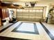 Spacious garage with tile flooring and ample storage cabinets at 1875 Oxford Ln, The Villages, FL 32162