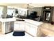 Open concept kitchen flowing into the living area at 1875 Oxford Ln, The Villages, FL 32162