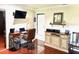 Comfortable office with wooden desk, accent lighting, and chair on wood floors at 1875 Oxford Ln, The Villages, FL 32162