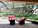 Screened-in patio with brick flooring, fire pit, and outdoor furniture at 1875 Oxford Ln, The Villages, FL 32162