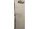 Modern tiled shower with rainfall showerhead for a relaxing experience at 1875 Oxford Ln, The Villages, FL 32162