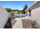 Charming backyard with a concrete pathway, privacy fence, and tropical landscaping at 2012 Braxton St, Clermont, FL 34711