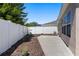 Spacious backyard features a concrete patio, well-kept mulch beds, and a privacy fence at 2012 Braxton St, Clermont, FL 34711