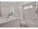 Bright and clean bathroom featuring a shower/tub combo and a well-lit vanity with storage at 2012 Braxton St, Clermont, FL 34711