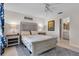 Stylishly decorated bedroom with decorative headboard, lamps, and plush bedding and ensuite access at 2012 Braxton St, Clermont, FL 34711