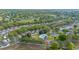 Aerial of the community, featuring a pool, tennis court, green space, and parking at 2012 Braxton St, Clermont, FL 34711