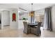 Bright dining area adjacent to the kitchen, featuring a modern table, comfortable seating, and sliding door to patio at 2012 Braxton St, Clermont, FL 34711