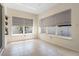 This sun room is a bright and airy space with tile flooring and large windows at 2012 Braxton St, Clermont, FL 34711