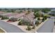 An aerial view of a neighborhood, with a well-maintained yard and a beautiful screened-in pool at 2026 Altamonte Way, The Villages, FL 32162