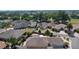 Birds-eye view displaying a 55+ community with mature trees, meticulously landscaped homes and community pool at 2026 Altamonte Way, The Villages, FL 32162