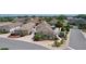 An aerial view showcases a neighborhood's well-maintained homes, lawns, landscaping, and serene ambiance at 2026 Altamonte Way, The Villages, FL 32162