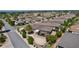 An aerial view reveals a community's appealing homes, featuring pools and well-kept lawns at 2026 Altamonte Way, The Villages, FL 32162