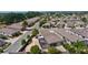 An aerial view showcasing homes in a well-maintained 55+ neighborhood with lush landscaping and mature trees at 2026 Altamonte Way, The Villages, FL 32162
