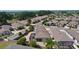 An aerial view of a 55+ community featuring well-kept homes, manicured lawns, and inviting screened in lanais at 2026 Altamonte Way, The Villages, FL 32162