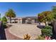 Expansive backyard featuring a screened lanai, well-kept landscaping, and decorative rocks at 2026 Altamonte Way, The Villages, FL 32162