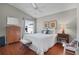 Comfortable bedroom featuring a ceiling fan, wood floors, and decor at 2026 Altamonte Way, The Villages, FL 32162
