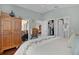Bedroom with a view to the lanai, closet, and bathroom at 2026 Altamonte Way, The Villages, FL 32162