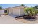 Well-maintained home featuring an attached garage, manicured landscaping, and a private driveway at 2026 Altamonte Way, The Villages, FL 32162