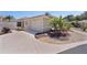 Stunning exterior shot showcasing the manicured lawn, two-car garage, and inviting facade of this lovely home at 2026 Altamonte Way, The Villages, FL 32162