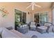 Enclosed patio featuring tile floors, wicker furniture, and sliding glass doors at 2026 Altamonte Way, The Villages, FL 32162