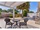 Charming screened patio featuring comfortable seating, a pergola, and tranquil backyard views at 2026 Altamonte Way, The Villages, FL 32162