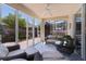 Covered patio with comfortable wicker furniture at 2026 Altamonte Way, The Villages, FL 32162