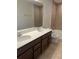 Bathroom featuring double sinks, countertop, and bath and shower combo at 2048 Airedale Way, Lake Alfred, FL 33850