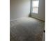 Bedroom featuring neutral carpeting and a bright window at 2048 Airedale Way, Lake Alfred, FL 33850