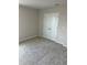 Bedroom featuring neutral carpeting and a closet with double doors at 2048 Airedale Way, Lake Alfred, FL 33850