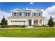 Beautiful two-story home featuring manicured lawn and inviting front porch at 2048 Airedale Way, Lake Alfred, FL 33850