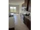 Kitchen featuring granite countertops and stainless steel appliances at 2048 Airedale Way, Lake Alfred, FL 33850