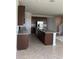 Spacious kitchen with granite countertops and stainless steel appliances at 2048 Airedale Way, Lake Alfred, FL 33850