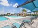 Resort-style pool featuring sun loungers and a covered picnic area at 2048 Airedale Way, Lake Alfred, FL 33850