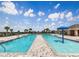 Community pool with a splashpad and plenty of seating at 2048 Airedale Way, Lake Alfred, FL 33850