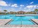 Large pool area with lounge seating and covered picnic area at 2048 Airedale Way, Lake Alfred, FL 33850