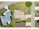 Birds eye view of this well-maintained home surrounded by lush, green lawn at 2104 Iveywood St, The Villages, FL 32163