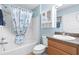 Bathroom featuring a shower over tub and a storage cabinet over the toilet at 2104 Iveywood St, The Villages, FL 32163