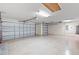 Spacious three-car garage with epoxy floor and storage capabilities at 2104 Iveywood St, The Villages, FL 32163