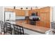 A kitchen with stainless steel appliances and light wood cabinets at 2104 Iveywood St, The Villages, FL 32163