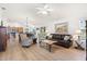 Bright and open living room featuring hardwood floors, modern furnishings, and abundant natural light at 2104 Iveywood St, The Villages, FL 32163